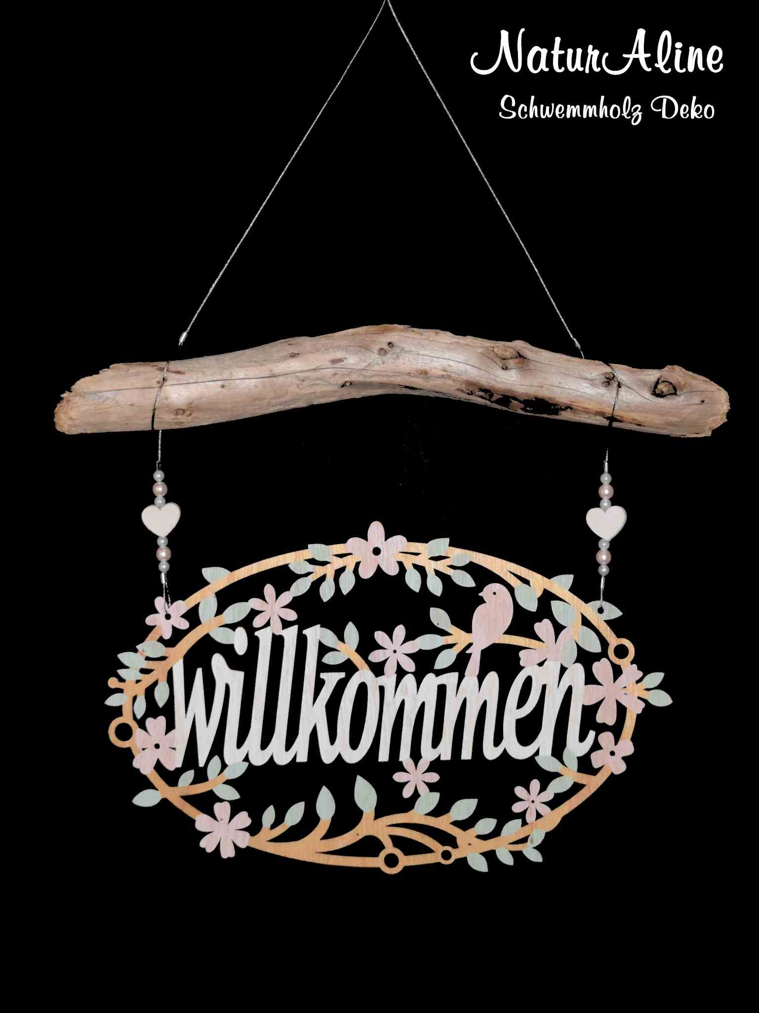 Schwemmholz Girlande mit ovalem Willkommensschild in Hellholz, Schriftzug in Weiss, Blüten in Rosa und Mint.